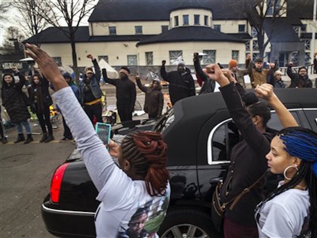 Four charged in Minneapolis protest shootings