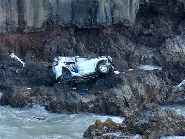 Woman charged with murder after crash kills twin