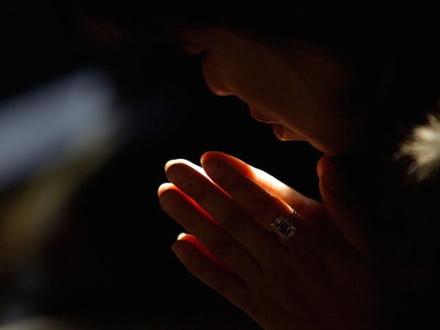 Woman crashes car into house after closing her eyes to pray