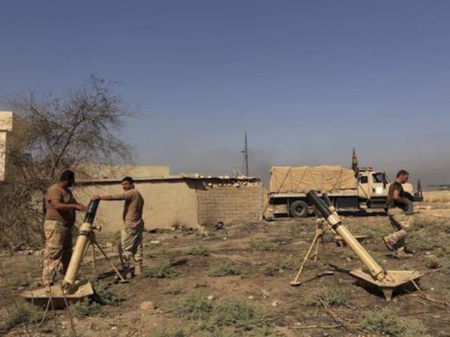 Iraq forces shell IS near Mosul; group urges airstrike probe