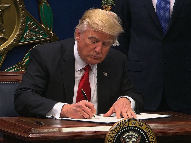 Judge rejects request to delay travel ban lawsuit