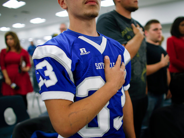 High school teacher fired for requiring student to stand for Pledge of Allegiance
