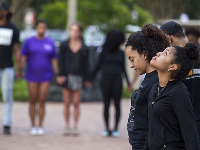 Athletes told not to wear school clothing while protesting