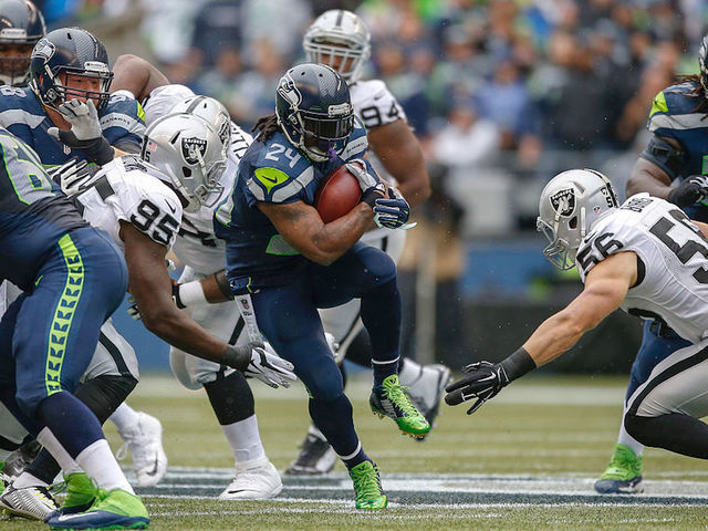 Marshawn Lynch takes a seat during National Anthem
