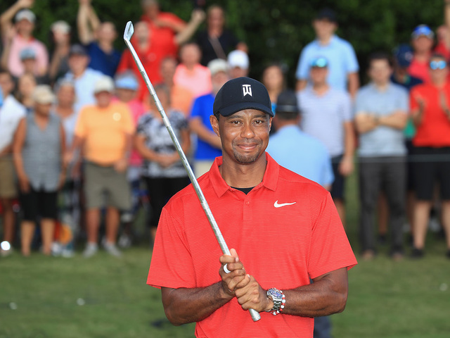 Tiger Woods wins a PGA Tour event for the first time since 2013