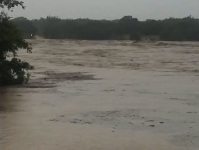 A flooded Texas river rose 35 feet in a day and crushed a bridge
